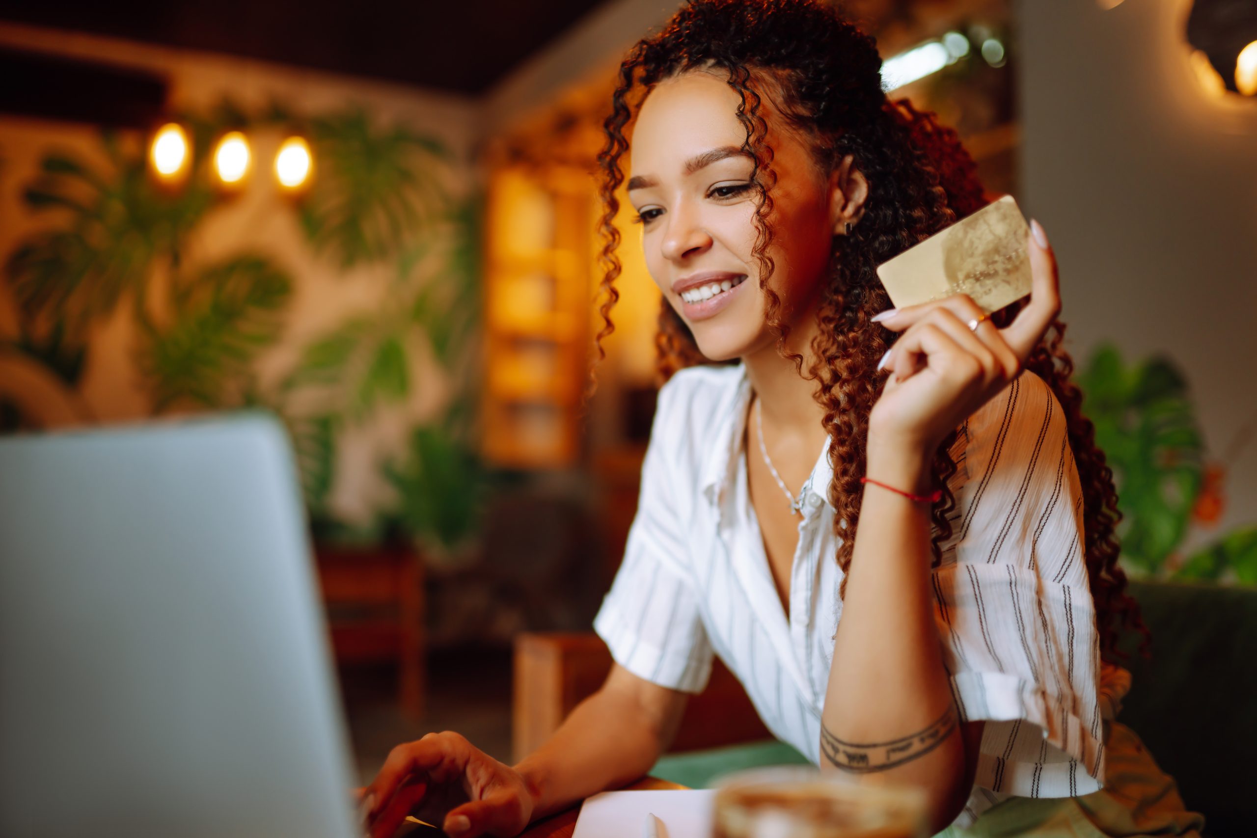 Young,Woman,Sitting,At,Cafe,Making,Online,Shopping,,Using,Credit