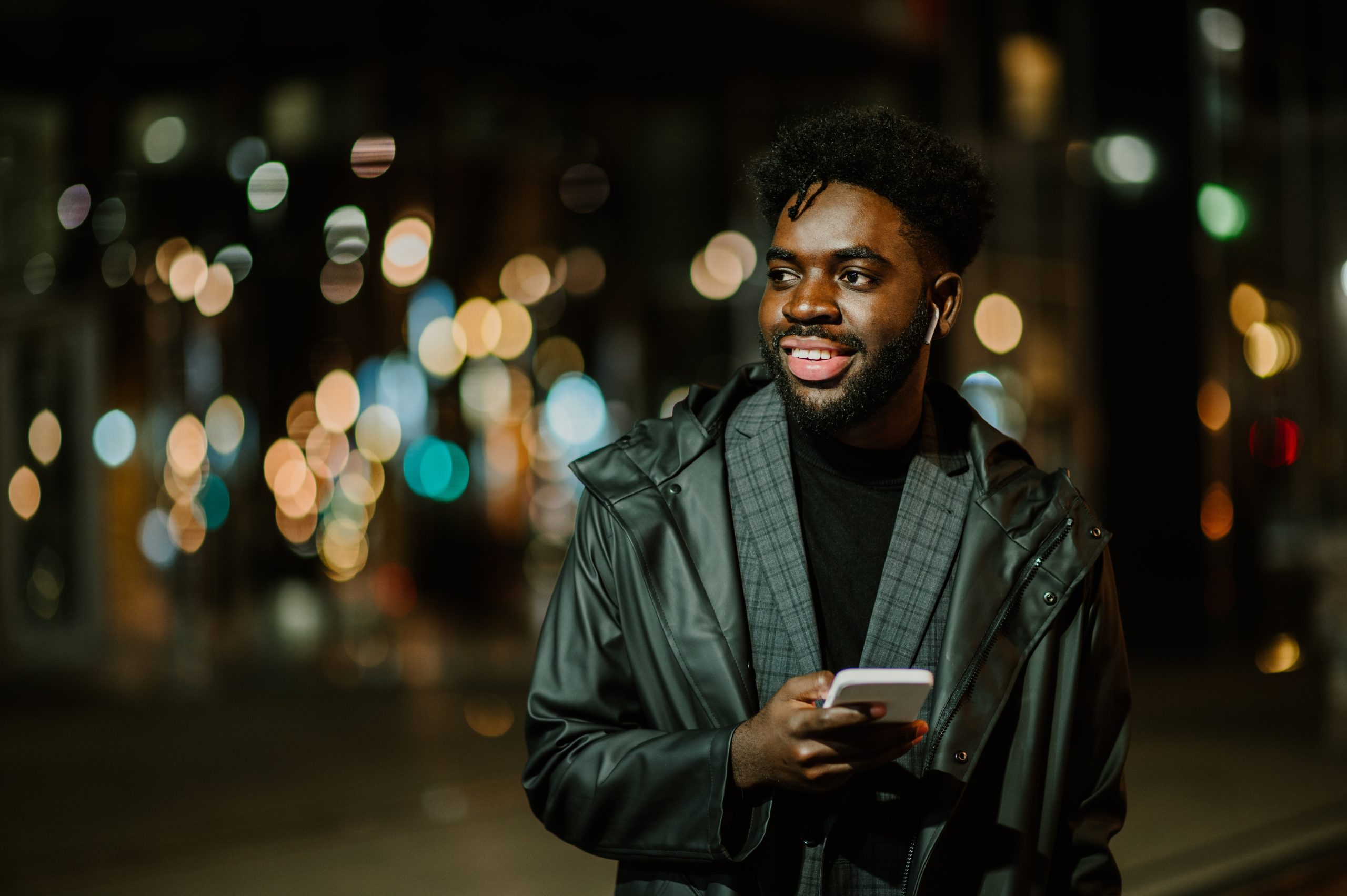 A,Happy,African,American,Modern,Man,Is,Using,His,Phone